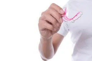A clear retainer, designed to help maintain teeth alignment after orthodontic treatment.