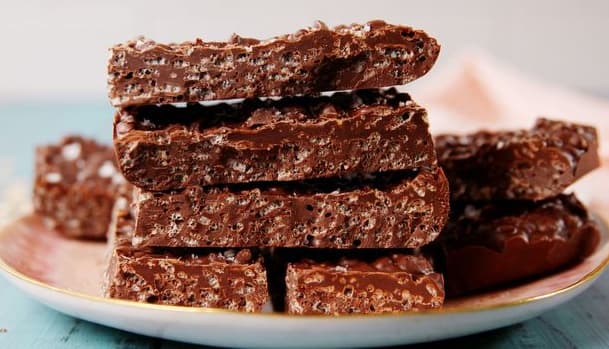 A close-up of crunchy candy, showcasing its hard texture and sugary coating.