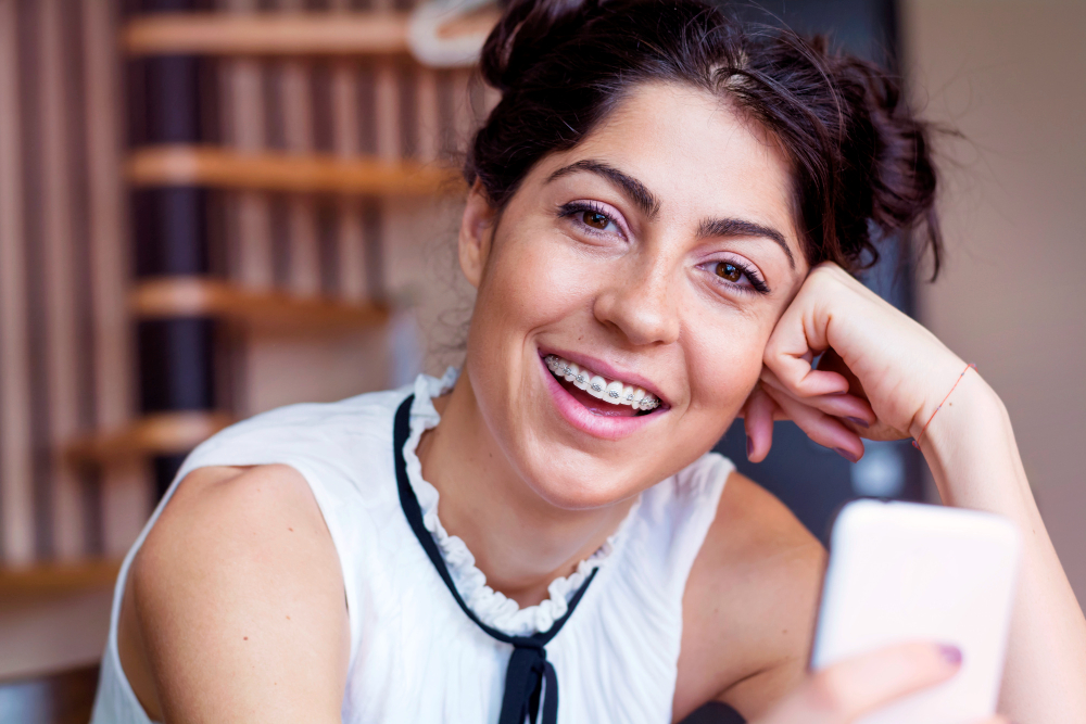 Adult patient discussing affordable braces options with orthodontist in Queens NY