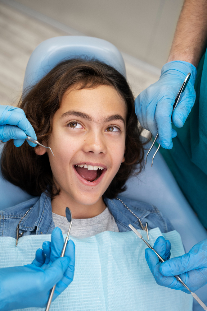 Child undergoing orthodontic treatment with braces or Invisalign during dental checkup