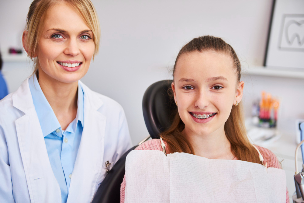 Orthodontist consulting with patient about braces treatment options in Queens NY clinic